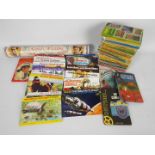 A collection of vintage Ladybird books, a quantity of tea card albums and other.