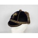 An antique university team sportsman's velvet cap with Maltese cross.