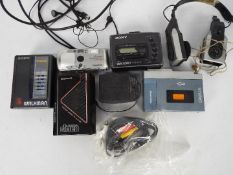 Two Sony Walkman portable cassette players, models WM-36 and WM-FX41,