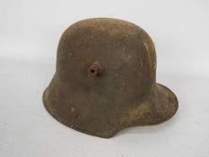 A World War One (WW1 / WWI) German steel helmet (stahlhelm) M16 with liner,