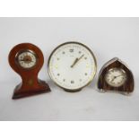 Three desk clocks, largest 15.5 cm (d).