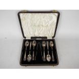 A cased set of six silver coffee spoons and tongs, Sheffield assay, 90 grams / 2.8 ozt.