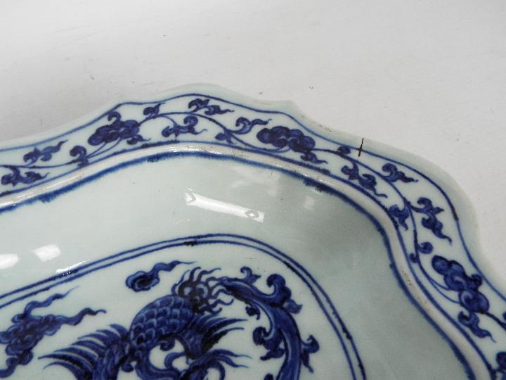 A Chinese blue and white dish decorated with phoenix amongst cloud scrolls, - Image 3 of 12