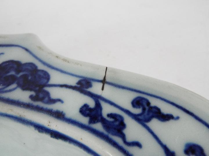 A Chinese blue and white dish decorated with phoenix amongst cloud scrolls, - Image 11 of 12