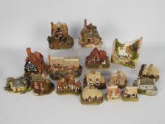 A collection of unboxed Lilliput Lane cottages.
