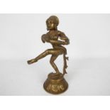 A South Asian bronze figure of a female dancer on lotus base,