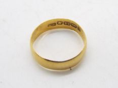 A 22ct gold wedding band, size I, approximately 1.7 grams all in.