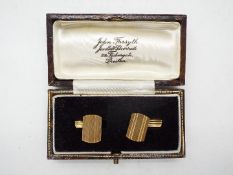 A gentleman's pair of 9ct gold cufflinks, hallmarks rubbed, approximately 5 grams all in.