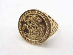 A 9ct gold dress ring in the form of a sovereign, embossed St George Medal, size Y, approximately 4.
