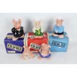Five Wade Natwest Pig money banks, three contained in original shipping packaging.