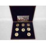 A limited edition Royal Regiments commemorative coin collection comprising eight gold plated proof