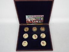A limited edition Royal Regiments commemorative coin collection comprising eight gold plated proof