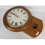 A late 19th/ early 20th century oak drop dial wall clock,