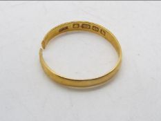 Scrap Gold - A 22ct gold wedding band (band cut) weighing approximately 2.