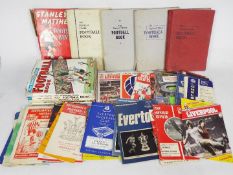 A collection of football related books including Topical Times and a quantity of match day