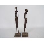 A pair of African bronze figures of slender, elongated form, possibly Benin,