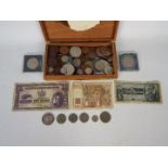 A collection of UK and foreign coins and banknotes,