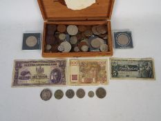 A collection of UK and foreign coins and banknotes,