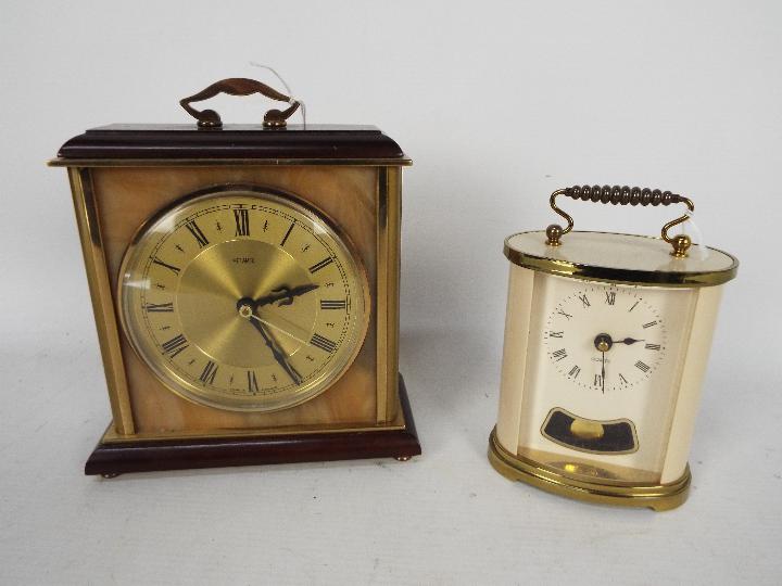 Two clocks comprising a Metamec and one other.