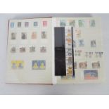 Philately - An album containing a collection of mounted mint stamps,