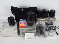 Photography - A boxed Olympus E510 kit with additional lenses, filters and camera bag.