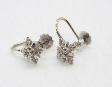 A pair of white metal, stone set, screw back earrings, stamped 9ct, approximately 2.5 grams.