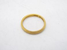 A 22ct yellow gold wedding band, size M, approximately 2.7 grams all in.