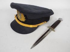 A William Rodgers, Sheffield fighting knife and a peaked cap.