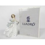 Lladro - A boxed figurine # 6193, Summer Serenade, depicting a young lady,