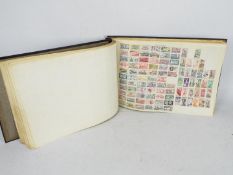 Philately - An album containing a quantity of world stamps.