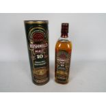 Bushmills - A 700ml bottle of 10 y/o single malt whiskey, 40% ABV, contained in tube.