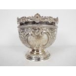 An Edwardian silver bowl with profuse repousse decoration, Sheffield assay 1903,