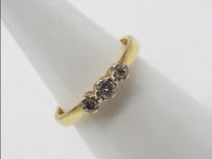 An 18ct yellow gold diamond trilogy ring, approximately 30 - 35 pts,