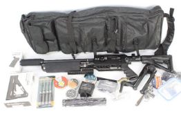 A Dreamline Tactical 0.177 (4.5mm) PCP air rifle and accessories.