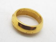 A mid purity yellow metal ring, presumed 14ct, size L, approximately 5.3 grams.