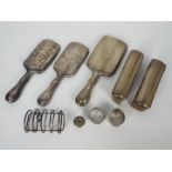 Silver items to include napkin rings, dressing table brushes, hand mirrors (two lacking glass),