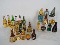 A collection of miniatures, predominantly whisky to include Vat 69, Grants, Bells, Beneagles,