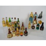 A collection of miniatures, predominantly whisky to include Vat 69, Grants, Bells, Beneagles,