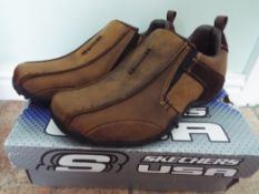 Skechers - a pair of brown trainers, siz