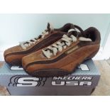 Skechers - a pair of brown urban track t