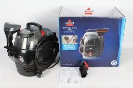 A boxed Bissell Spotclean Pro, carpet and upholstery cleaner.