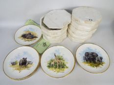 Eight David Shepherd collector plates wi