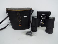 A pair of Boots Admiral binoculars, 10 x 50 mm, contained in case.