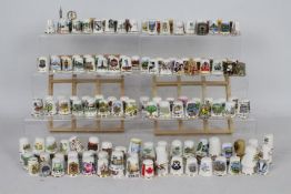A collection of thimbles to include ceramic, cloisonne, metal.