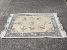A Kayam rug with floral decoration measuring approximately 190 cm x 122 cm