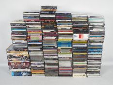 A large quantity of compact discs and a small quantity of DVDs to include The Who, The Doors,