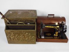 Lot to include a vintage Singer sewing machine in wooden case, brass clad coal box and similar.