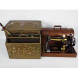 Lot to include a vintage Singer sewing machine in wooden case, brass clad coal box and similar.