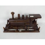 A carved wooden model of a steam locomotive, approximately 45 cm (l).