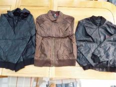 A job lot of three zip front, faux leather jackets, black L, brown M and black M,
